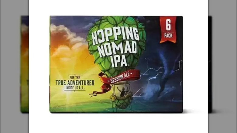 a six-pack of Hopping Nomad IPA against a white background.