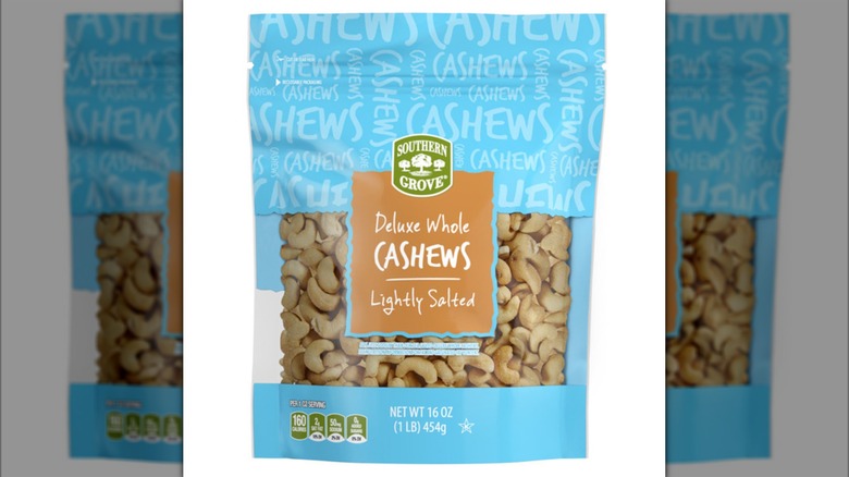 a bag of Southern Grove Deluxe Whole Lightly Salted Cashews against a white background.