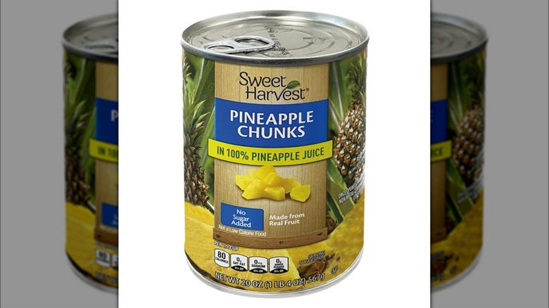 a can of Sweet Harvest Pineapple Chunks against a white background.