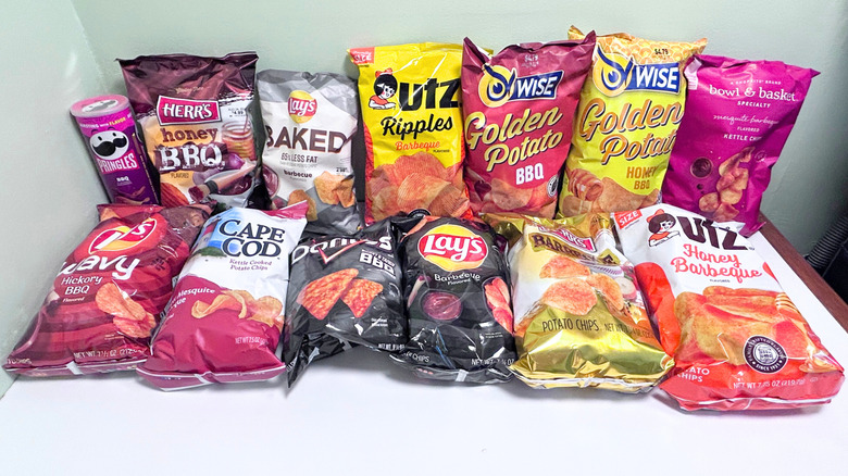 Several bags of BBQ chips lined up against a green and white background