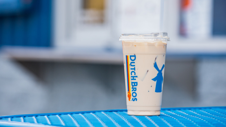 Dutch Bros iced drink on a bench
