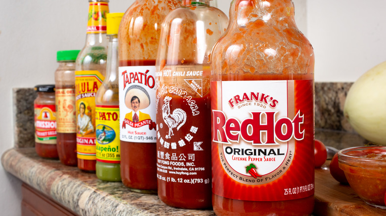 Bottles of hot sauce lined up