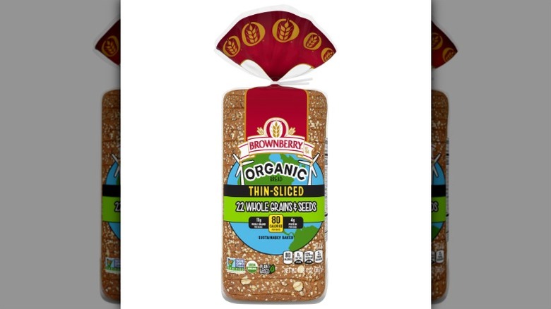 a loaf of Brownberry Thin-Sliced 22 Whole Grains & Seeds bread in its packaging against a white background.