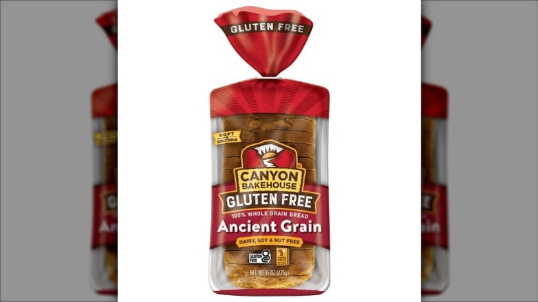 a loaf of Canyon Bakehouse Gluten Free Ancient Grain Bread on a white background.
