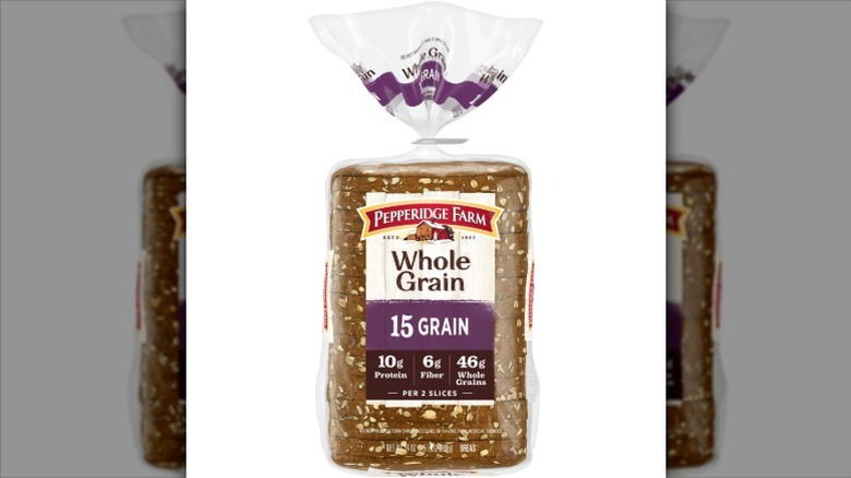 a Pepperidge Farm Whole Grain 15 Grain Bread loaf in its packaging against a white background.