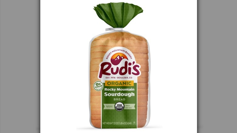 a loaf of Rudi's Rocky Mountain Sourdough in its packaging against a white background.