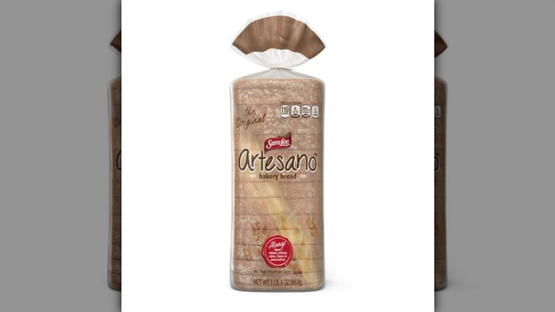 a loaf of Sara Lee Artesano Bakery Bread in its packaging against a white background.