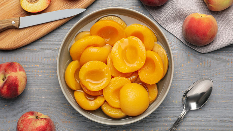 canned peach halves on plate