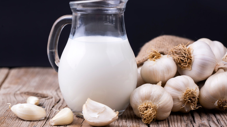 Milk pitcher and fresh garlic