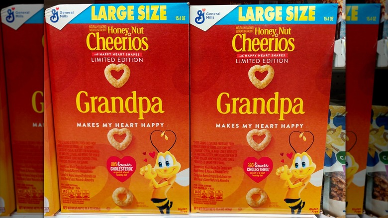 Two boxes of Honey Nut Cheerios on the shelf that say "Grandpa"