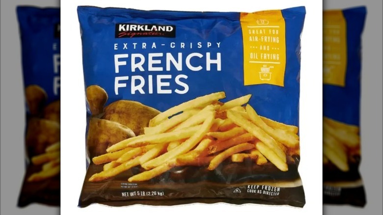view of a bad of Kirkland Signature Crispy French Fries, with cooked fries on the front.