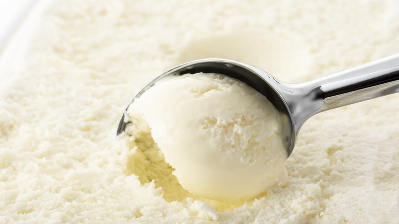scooping vanilla ice cream