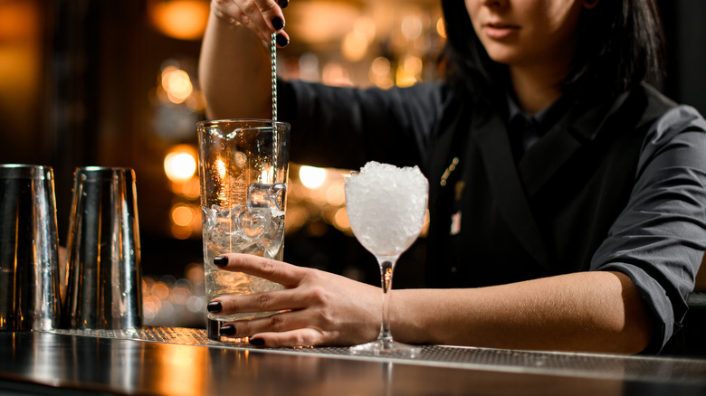 Bartender stirring a martini