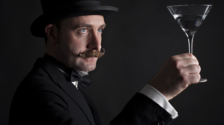 Man holding martini glass