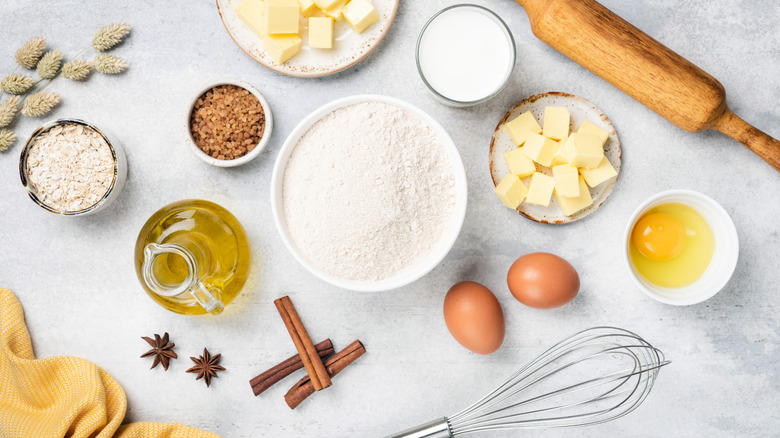 Baking ingredients and equipment on a marble table