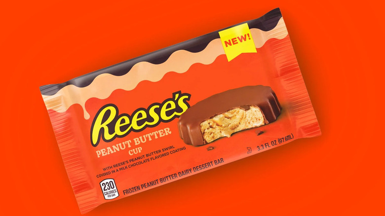 A package of frozen Reese's Peanut Butter Cup against an orange background.