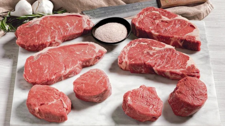 Rastelli's Antibiotic-free Grass-fed Angus Steak Box on white cutting board