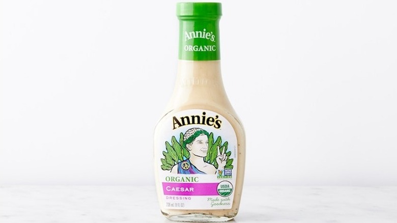 Annie's caesar dressing on white background