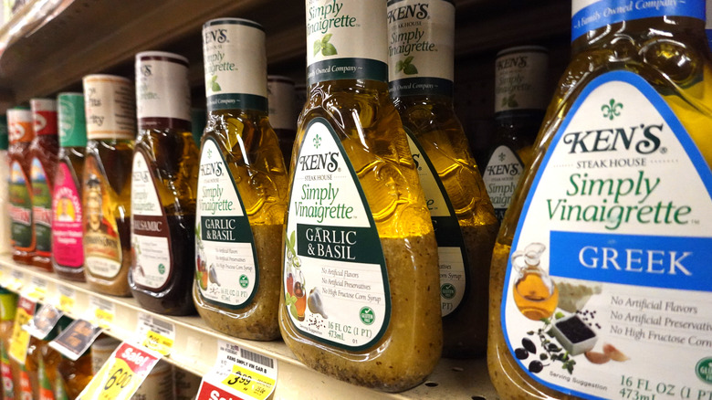 Row of salad dressings on shelf