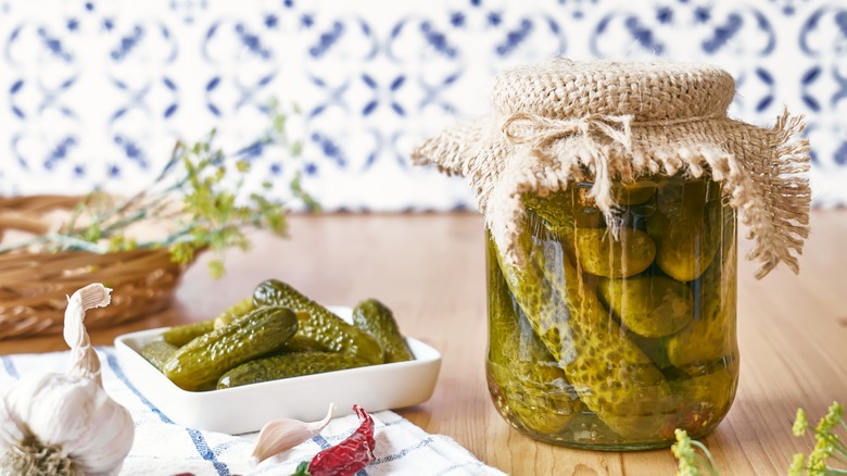Jar and plate of pickles