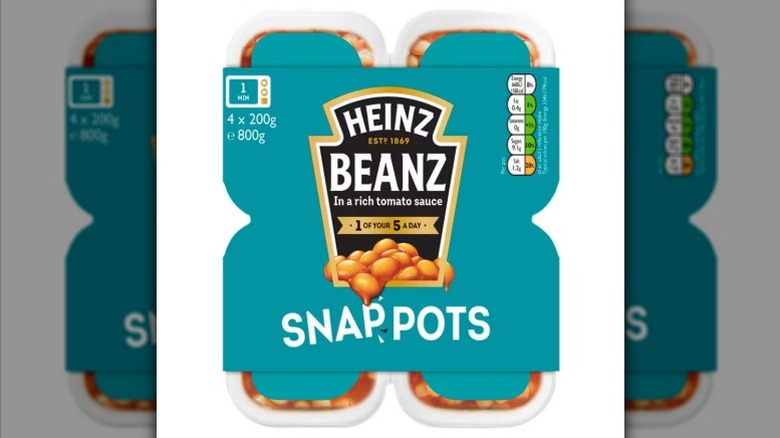 a four-pack of Heinz Beanz Snap Pots against a white background.
