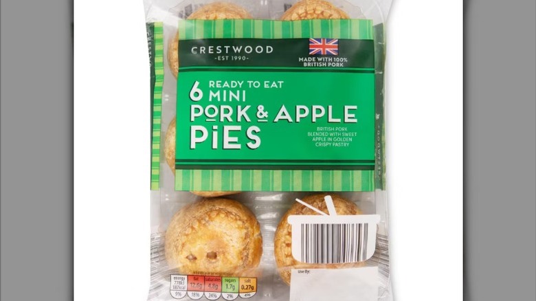 a six pack of mini pork and apple pies against a white background.