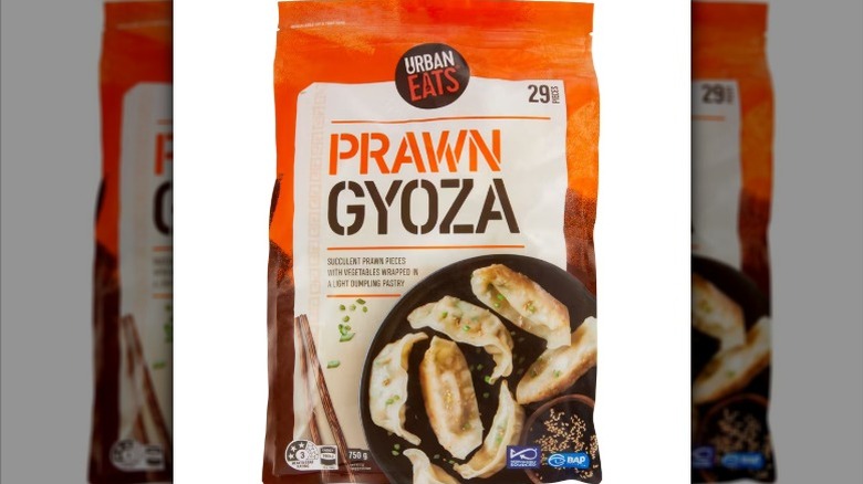 a bag of frozen prawn gyoza against a white background.
