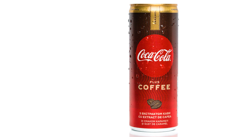 A can of Coca-Cola Plus Coffee Caramel against a white background.