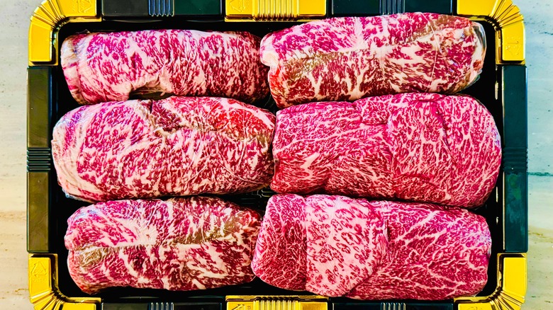 Pieces of raw Hanwoo beef on a decorative platter