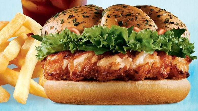 Shrimp burger, fries, and soda