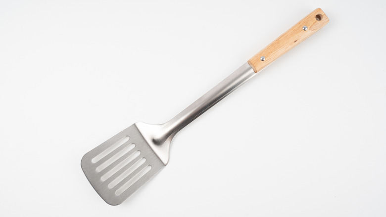 Metal spatula with wooden handle