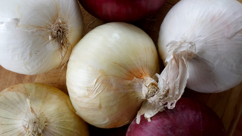 various onions on wood