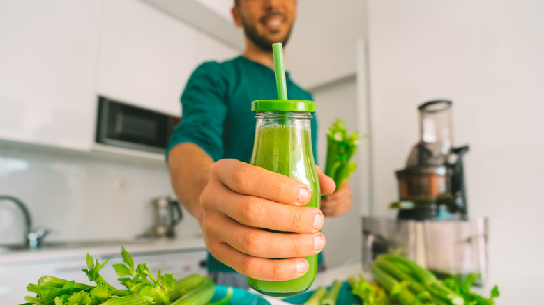 Man holding green juice