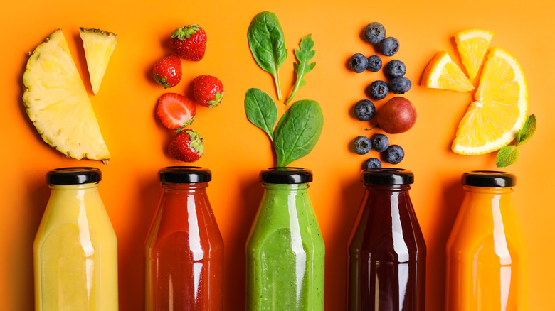 Colorful juices in sealed bottles