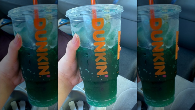 Dunkin' Energy Punch drink in hand