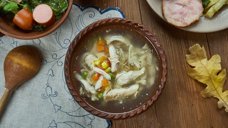 bowl of dutch-style rivel soup on a table with other foods