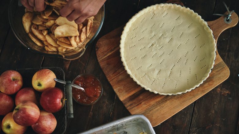 Apple pie crust with filling being prepared
