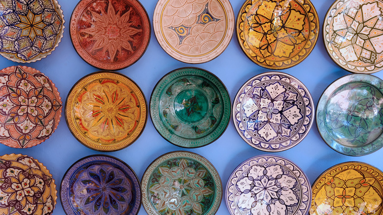 colorful patterned plates against blue background
