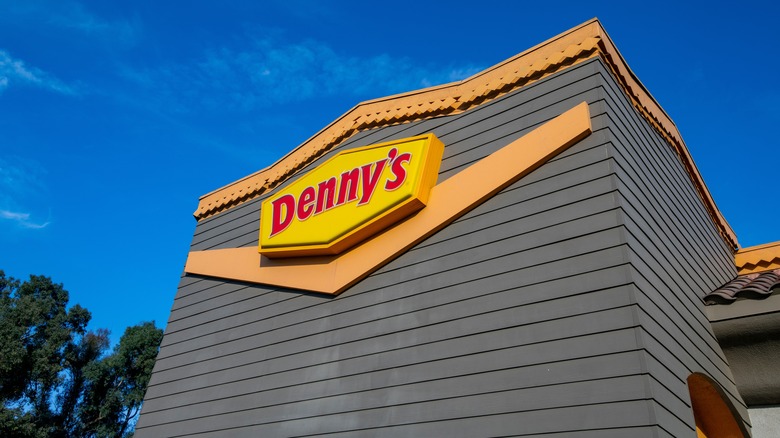 Denny's restaurant exterior, against a blue sky