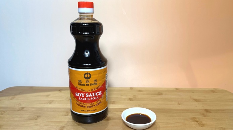 Bottle and small bowl of Wan Ja Shan soy sauce