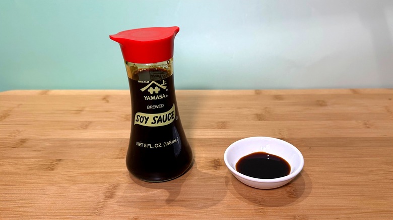 Bottle and small bowl of Yamasa soy sauce