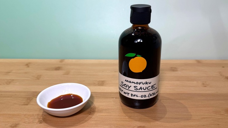 Bottle and small bowl of Momofuku soy sauce