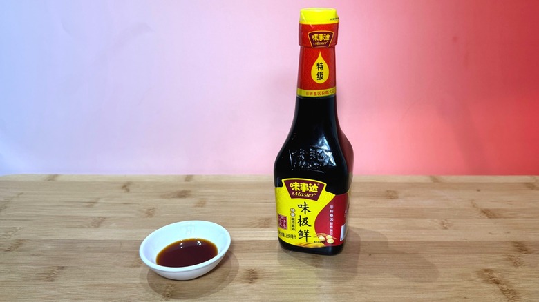 Bottle and small bowl of Master soy sauce