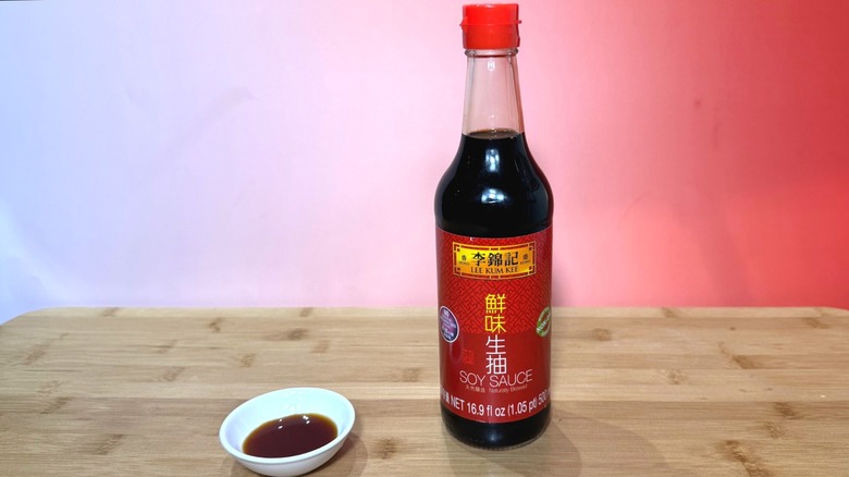 Bottle and small bowl of Lee Kum Kee soy sauce