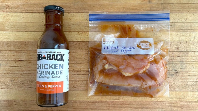 Rib Rack Citrus and Pepper Chicken Marinade bottle and bag with marinating chicken