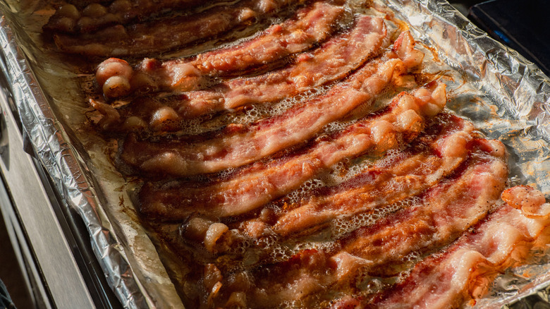 Oven-baked bacon, cooked on aluminum foil
