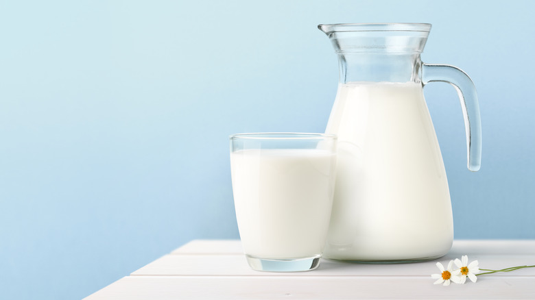 milk in clear carafe and glass