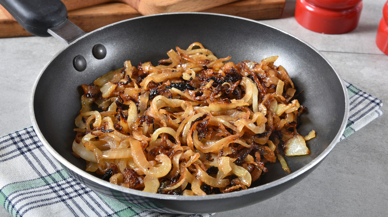 A generous amount of fried onions in a pan
