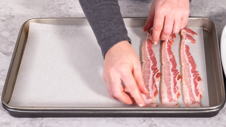bacon placed on parchment paper