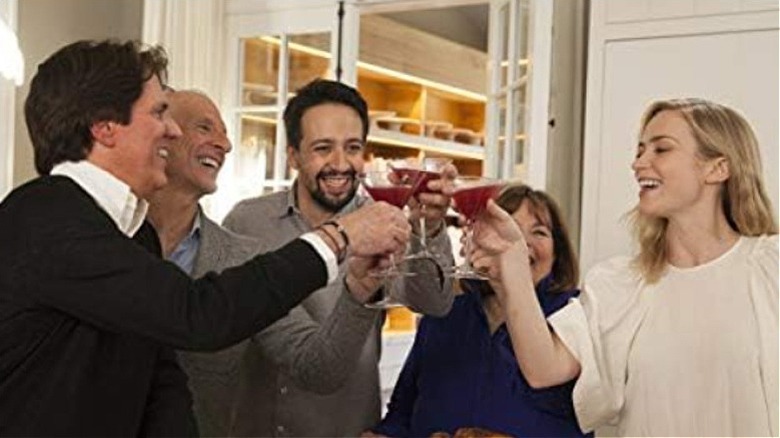 Emily Blunt, Ina Garten, and others toasting with martini glasses